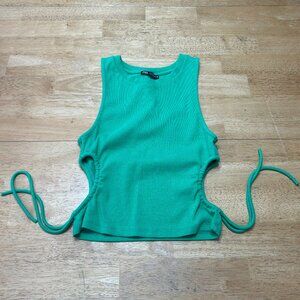 Tank with side cut-outs